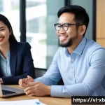 Home 22 정서적 민첩성을 위한 효과적인 피드백 기술 - A diverse group of Vietnamese office colleagues in a modern, bright workspace engaging in a team mee...