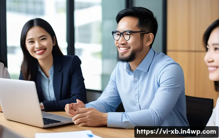 정서적 민첩성을 위한 효과적인 피드백 기술 - A diverse group of Vietnamese office colleagues in a modern, bright workspace engaging in a team mee...